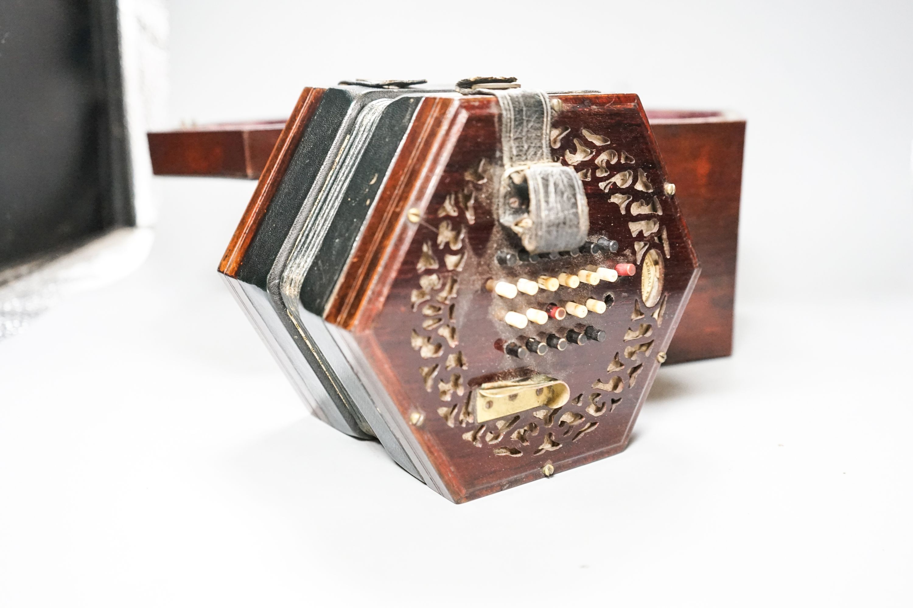 A Victorian Lachenal concertina with 48 buttons in rosewood case